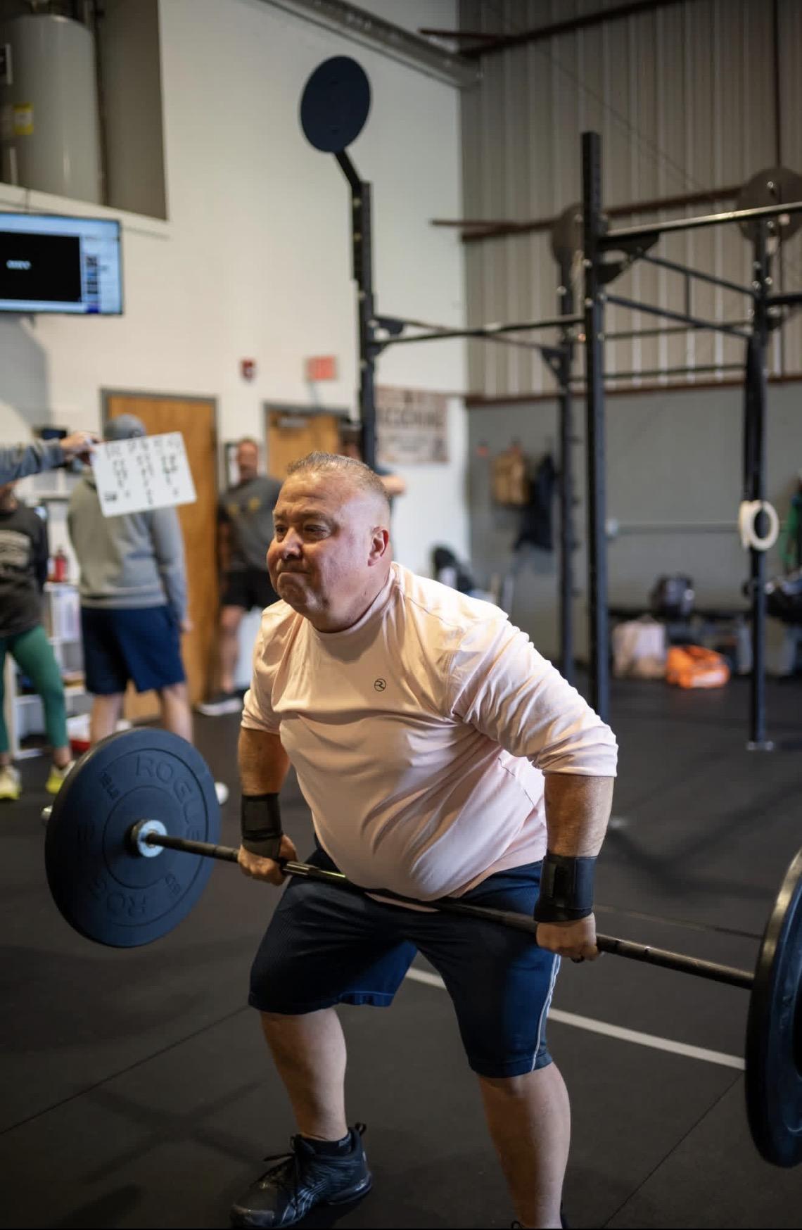Member overhead pressing — Mental health and strength training