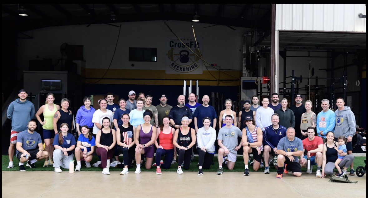 CrossFit Reckoning members and friends gathered for a group photo after completing Murph 2026 inside the gym in Coatesville, PA